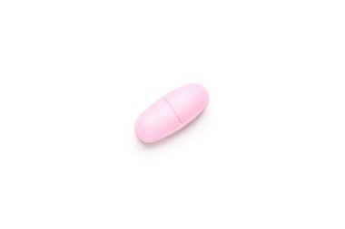 Beyaz arka planda tek bir pembe hap, multivitamin tableti veya diyet takviyesi.