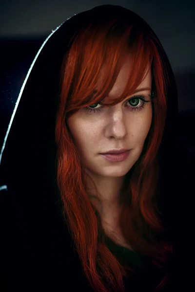 Portrait of beautiful red hair woman in black — Stok Foto