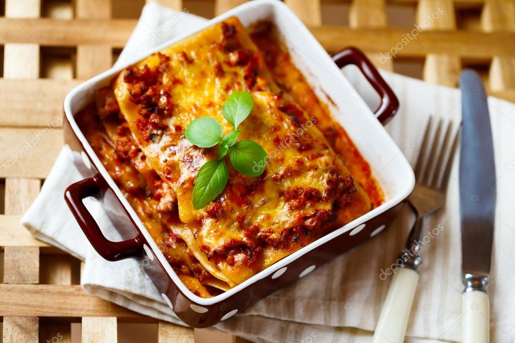 Italian Food. Lasagna plate with fresh basil.