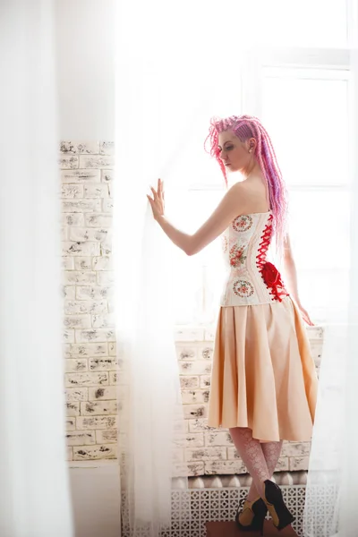 Freaky young female model wearing corset — Stock Photo, Image