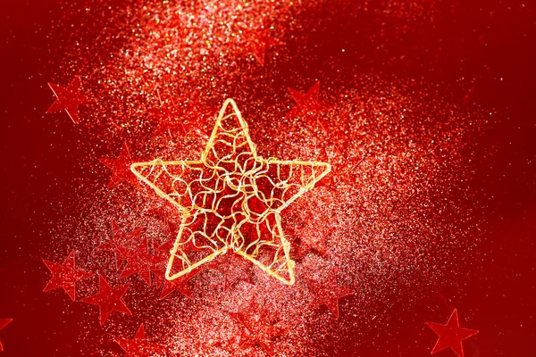 Červené třpytky dekorace s velkou zlatou hvězdou — Stock fotografie
