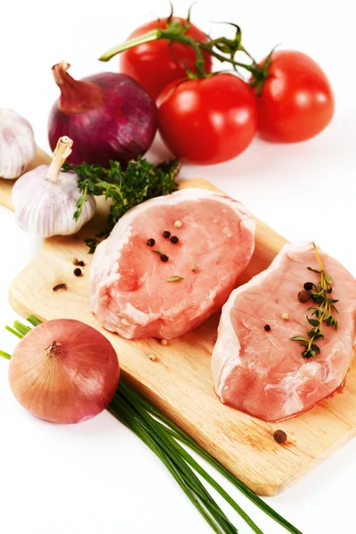Fresh pork meat steaks with vegetables — Stock Photo, Image