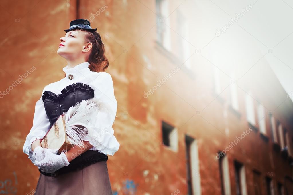 Beautiful redhair woman in vintage clothes 