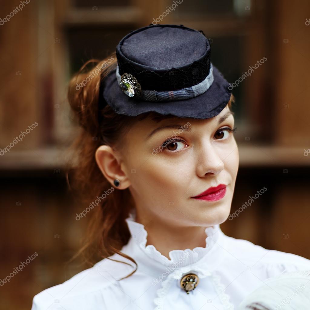 Beautiful redhair woman in vintage clothes 
