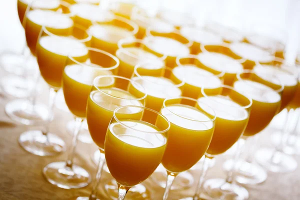 Fresh orange juice in high glasses — Stock Photo, Image