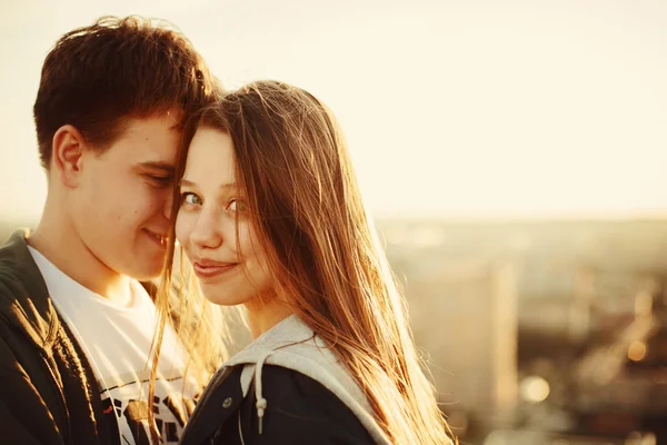 Sunny outdoor portrait of young happy couple — Stock Photo, Image