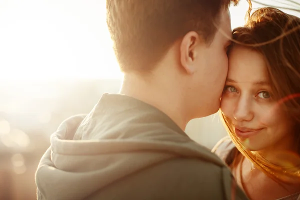 Sunny outdoor portrait of young happy couple — Stock Photo, Image