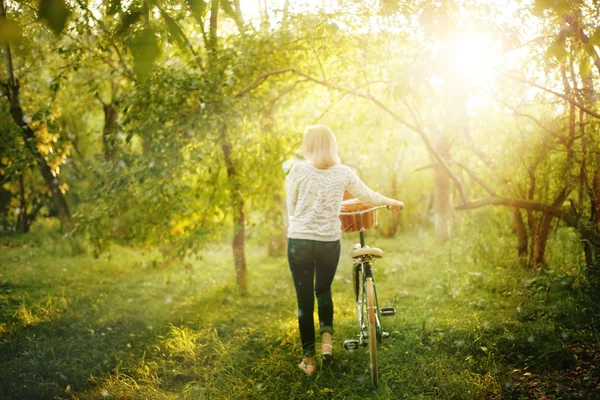 Blurred image of female with bicycle — Stock Photo, Image