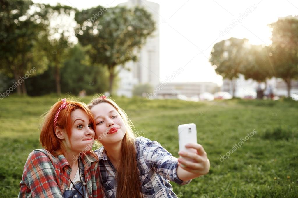 Two Young Hipster Girls Taking Selfie