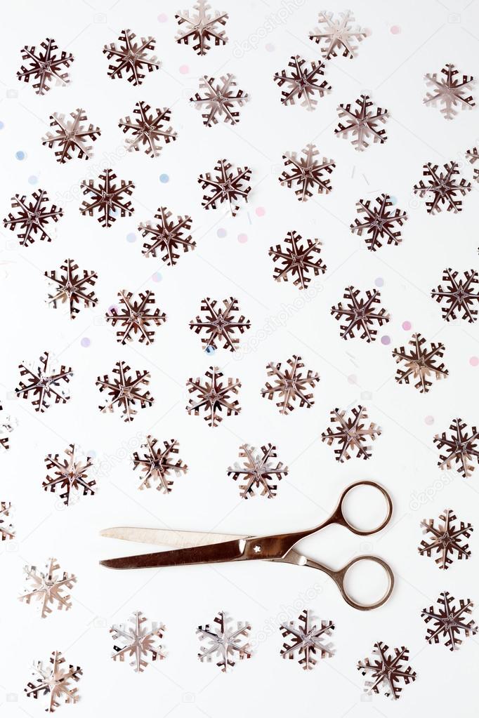 Pair of Scissors among Silver Snowflakes
