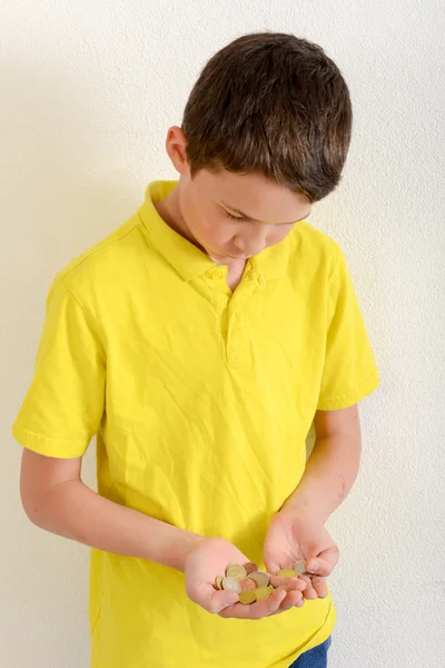 Boy counting euro coins — Stock Photo, Image