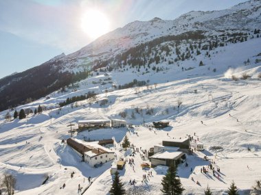 Nara, Switzerland - 26 December 2020: people skiing on the slopes of Nara in the Swiss Alps