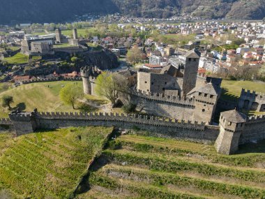Aerial view at Montebello and Castelgrande castles at Bellinzona on the Swiss alps, Unesco world heritage clipart