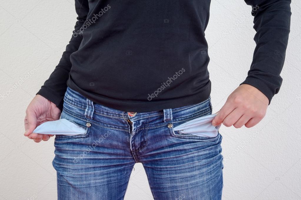 Woman showing empty pockets — Stock Photo © Fotoember 54899497