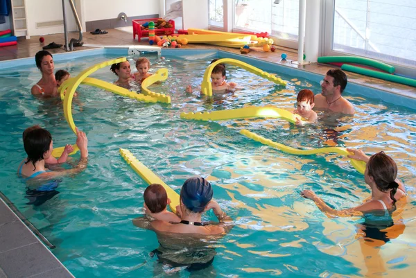 Early development swim teaching class for infants — Stock Photo, Image