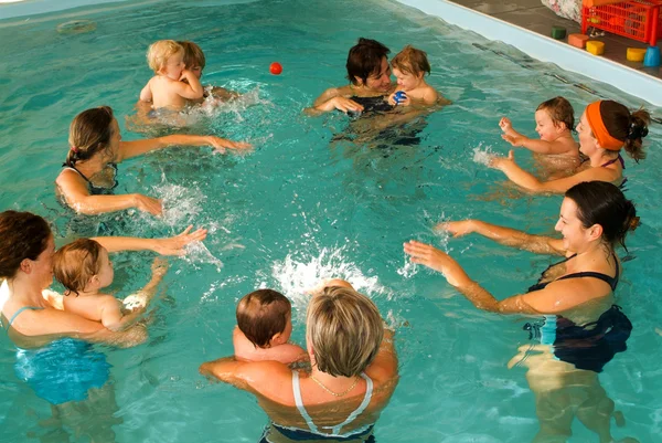 Early development swim teaching class for infants — Stock Photo, Image