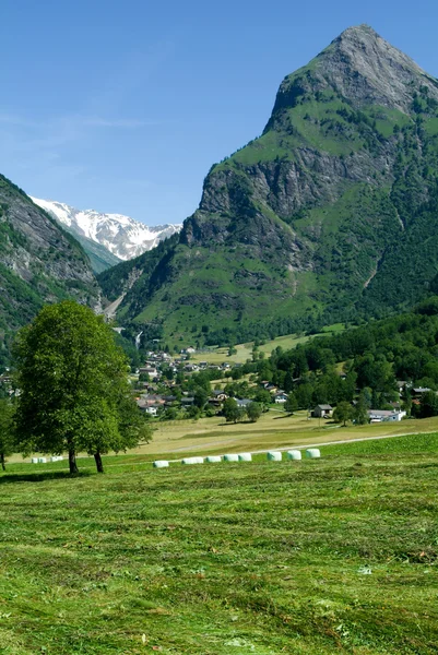 Landscape with hay bales at Olivone — Stock Photo, Image