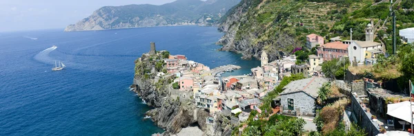 Scenic view of colorful village Vernazza and ocean coast