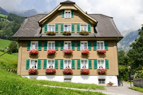 House decorated with flowers at Engelberg — Stock Photo, Image