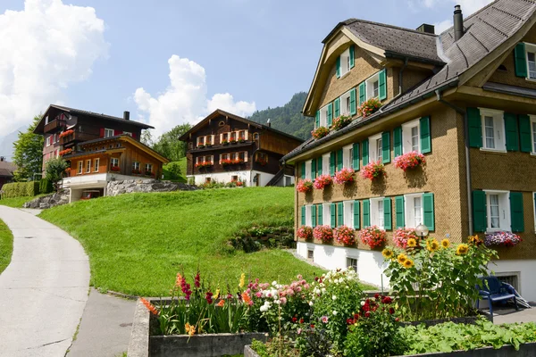 Flowers and vegetable garden of a house at Engelberg — Stock Photo, Image