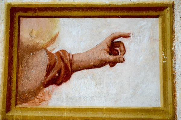 Hand on a fresco at Sacred Mount Orta — Stock Photo, Image
