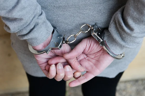 Arrested woman in handcuffs — Stock Photo, Image