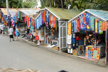 Stalls with colorful souvenirs at Sosua, Dominican Republic clipart