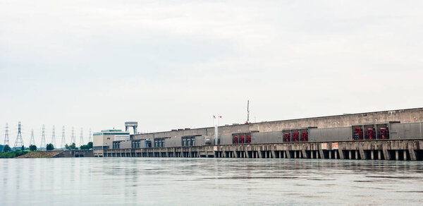 CORNWALL, ONTARIO, CANADA - JUNE 18, 2018: The Moses-Saunders Power Dam straddles the border between Canada and the United States, generating significant amounts of electricity and regulating the St. Lawrence River.