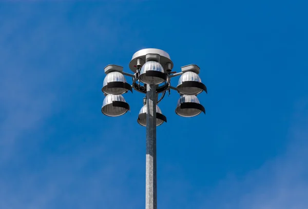 Top of flood lights pointing down on sky — Stock Photo, Image