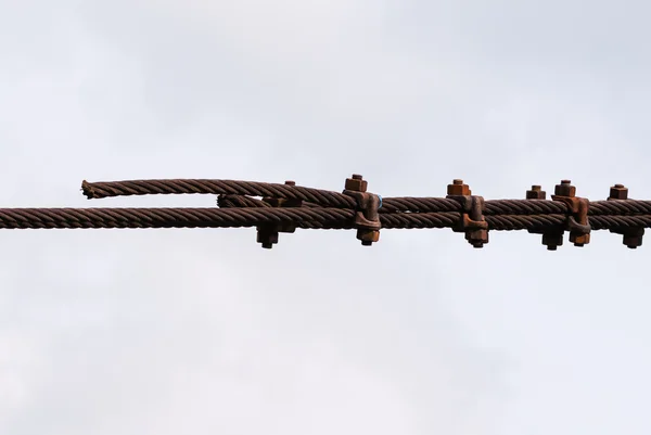 Rusted metal cables fastened together — Stock Photo, Image