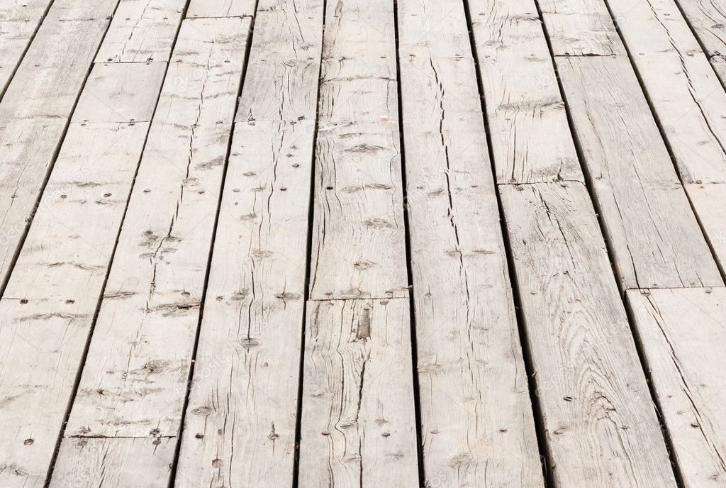 Cracked weathered wood deck boards