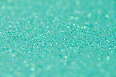 Green glitter texture. New Year or christmas background for greeting card. Valentines Day celebration. Shiny sparkle design for festive decoration: wedding, holiday or anniversary party. clipart