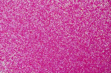 Pembe parıltı dokusu. Yeni yıl ya da tebrik kartı için yeni yıl arkaplanı. Sevgililer Günü kutlaması. Şenlik dekorasyonu için parlak bir tasarım: düğün, bayram veya yıldönümü partisi.