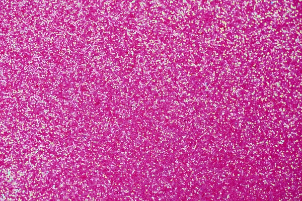 Pembe parıltı dokusu. Yeni yıl ya da tebrik kartı için yeni yıl arkaplanı. Sevgililer Günü kutlaması. Şenlik dekorasyonu için parlak bir tasarım: düğün, bayram veya yıldönümü partisi.