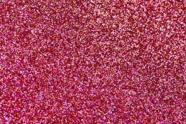 Kırmızı simli kumaş. Yeni yıl ya da tebrik kartı için yeni yıl arkaplanı. Sevgililer Günü kutlaması. Şenlik dekorasyonu için parlak bir tasarım: düğün, bayram veya yıldönümü partisi.