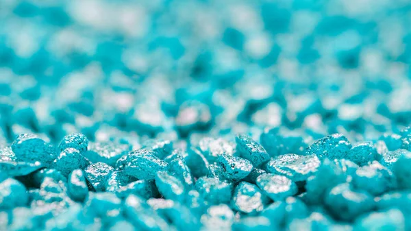 Turquoise gemstone fake pattern. Blue glitter stones for garden decoration, flat lay, top view background. Shallow DOF