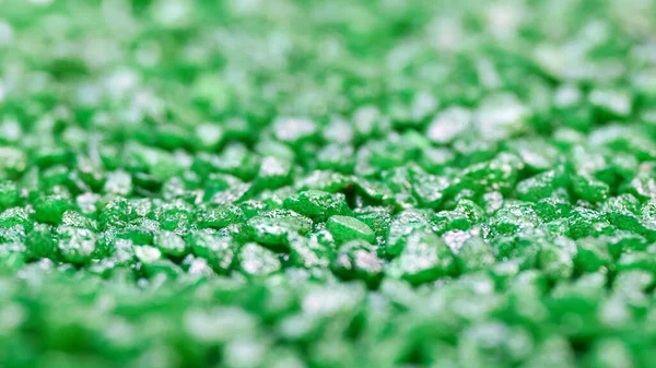 Emerald gemstone fake pattern. Green glitter stones for garden decoration, flat lay, top view background. Shallow DOF