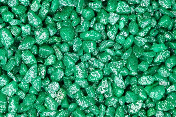 Emerald green gemstone pattern. Glitter semiprecious stones for decoration, flat lay, top view background.