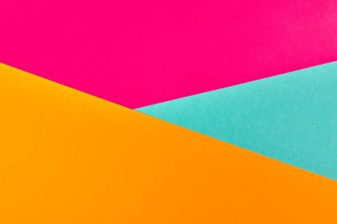 Çok renkli kağıt arkaplan. Soyut renkli kağıt dokusu, kopyalama alanı. Tasarım için parlak renkler geometrik arkaplan. Sunumlar için renk boşluğu.