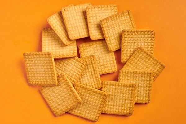 Square Biscuits Orange Background Delicious Snack Square Cookies — Stock Photo, Image
