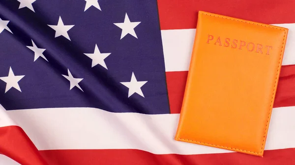 Passport on United States of America flag. National USA flag, patriotic symbol of America. Citizenship concept.