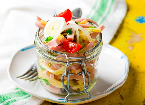 Sausage ,cheese and vegetables salad in a glass jar — Stock Photo, Image