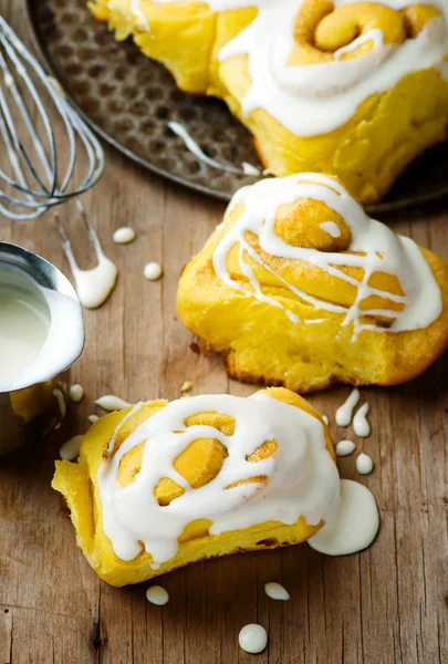 Cinnamon roll with pumpkin and glaze Stock Image