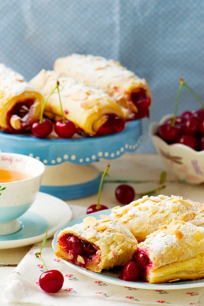 Pies from puff pastry with cherry — Stock Photo, Image