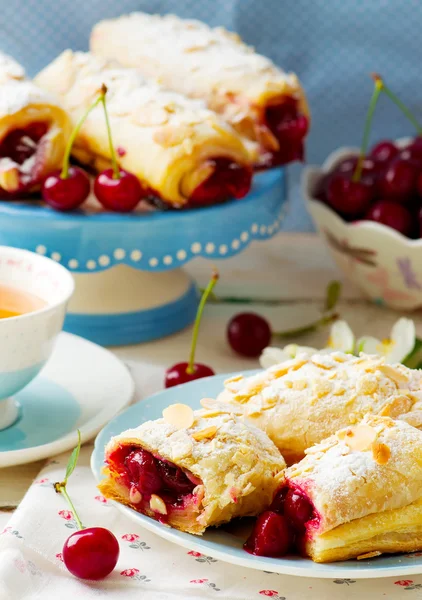 Pies from puff pastry with cherry — Stock Photo, Image