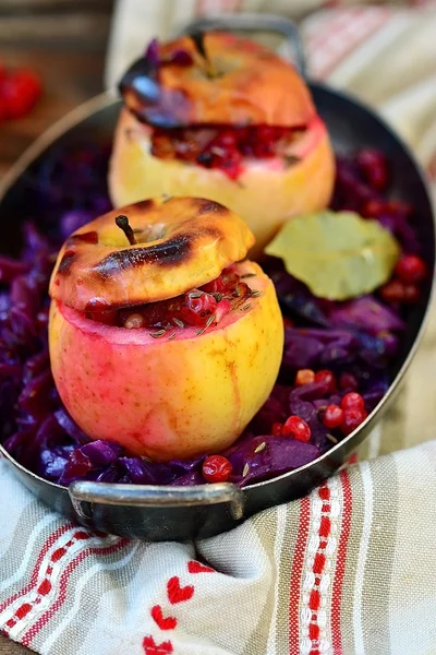 stewed red cabbage with the stuffed apples in a metal vintage bowl