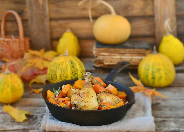 The baked chicken with pumpkin in a pig-iron frying pan — Stock Photo, Image