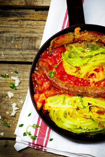 The baked cabbage with sausages and sauce — Stock Photo, Image