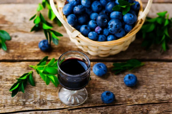 Liqueur from blueberry in a shot glass — Stock Photo, Image