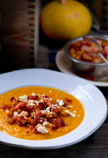 Pumpkin soup with chickpea and bacon — Stock Photo, Image